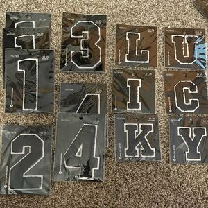 Gallon bag of various iron on/sew on numbers and letters
